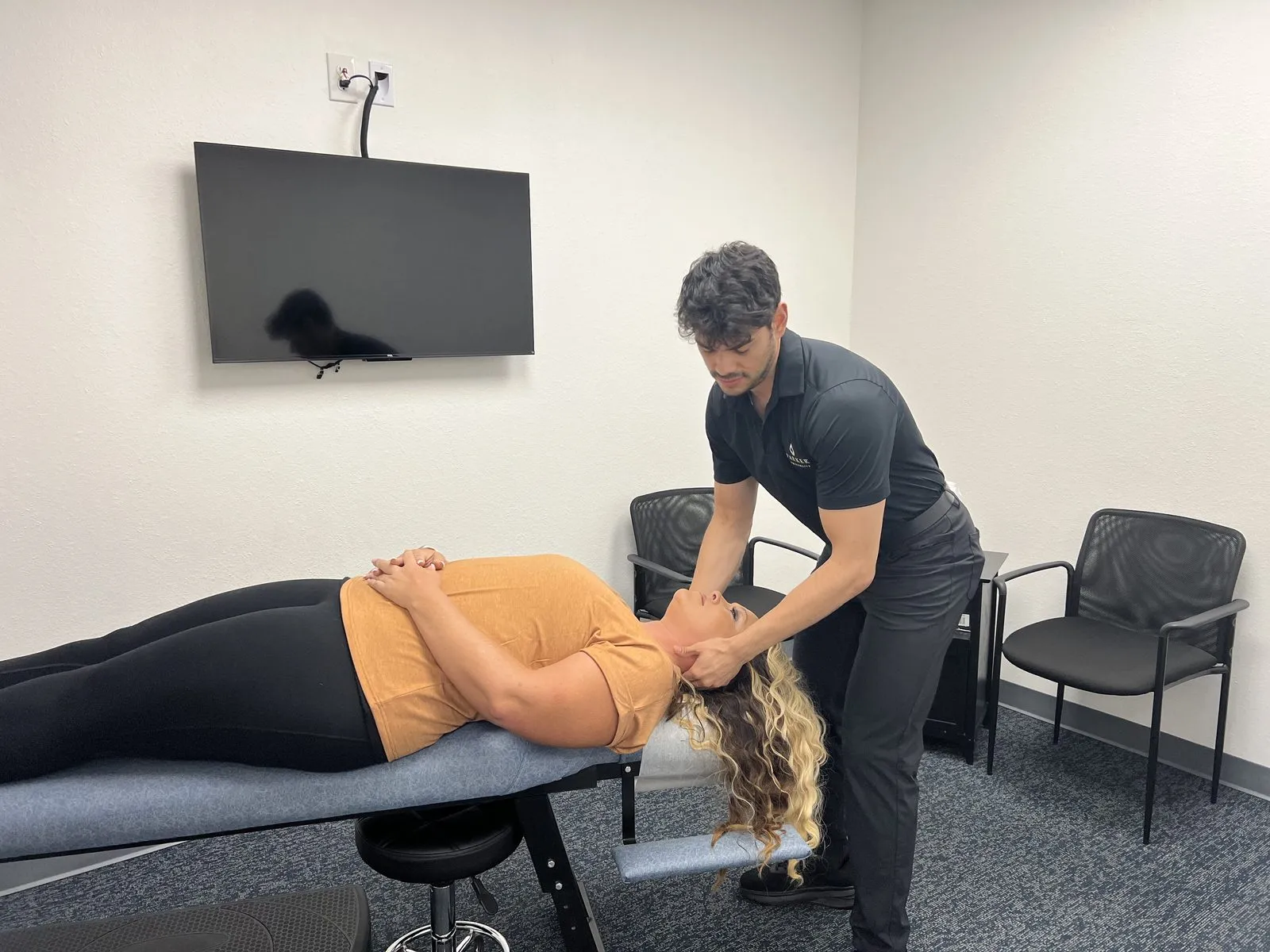 Chiropractor performing a spinal adjustment at Quantum Chiropractic in Burleson, TX