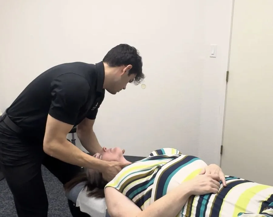 Chiropractor treating neck pain in Burleson, TX
