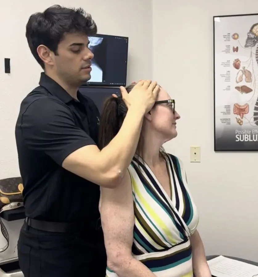 Chiropractor performing a spinal adjustment in Burleson, TX